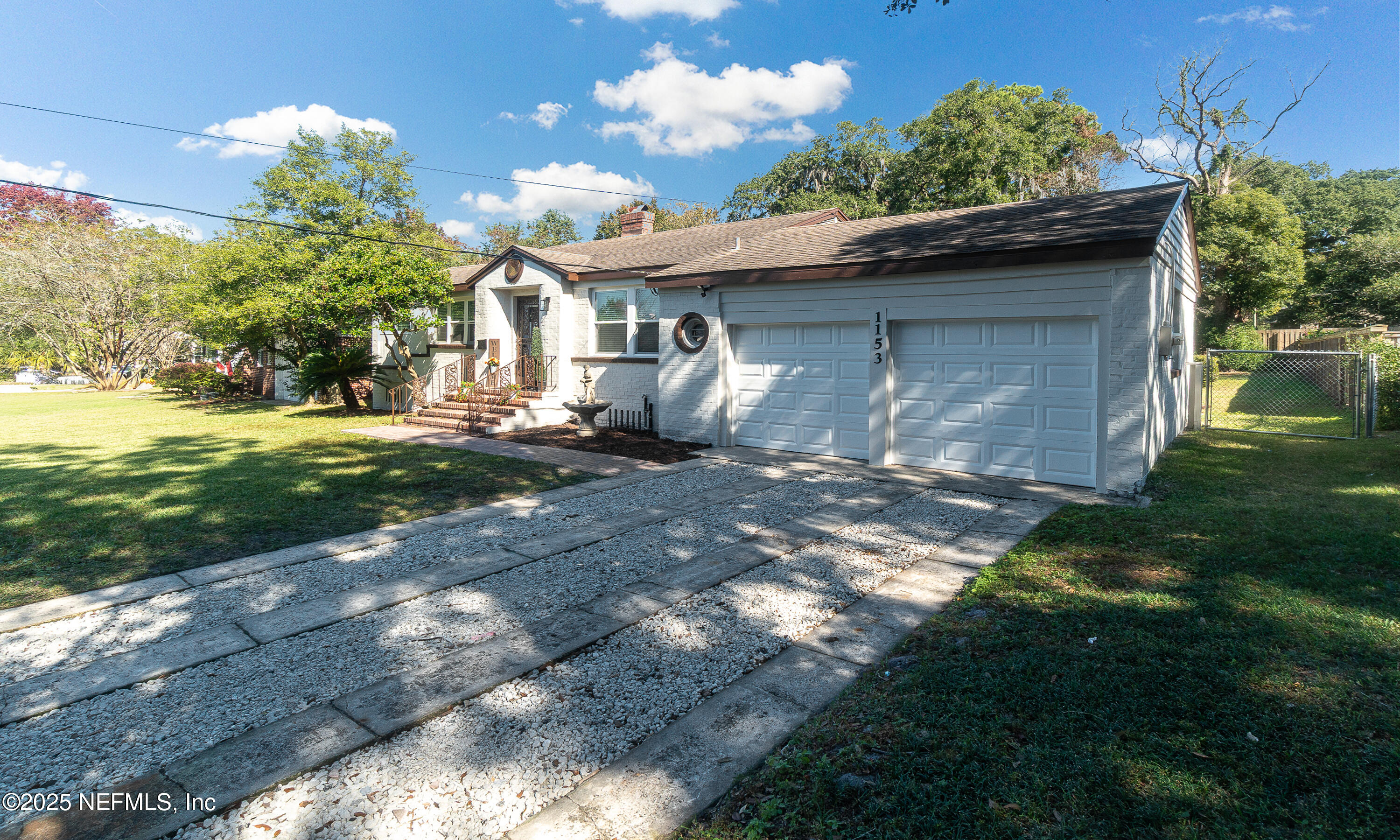 1153 Monticello Road Jacksonville, FL 32207 - Photo 36 of 37 a backyard of a house with table and chairs