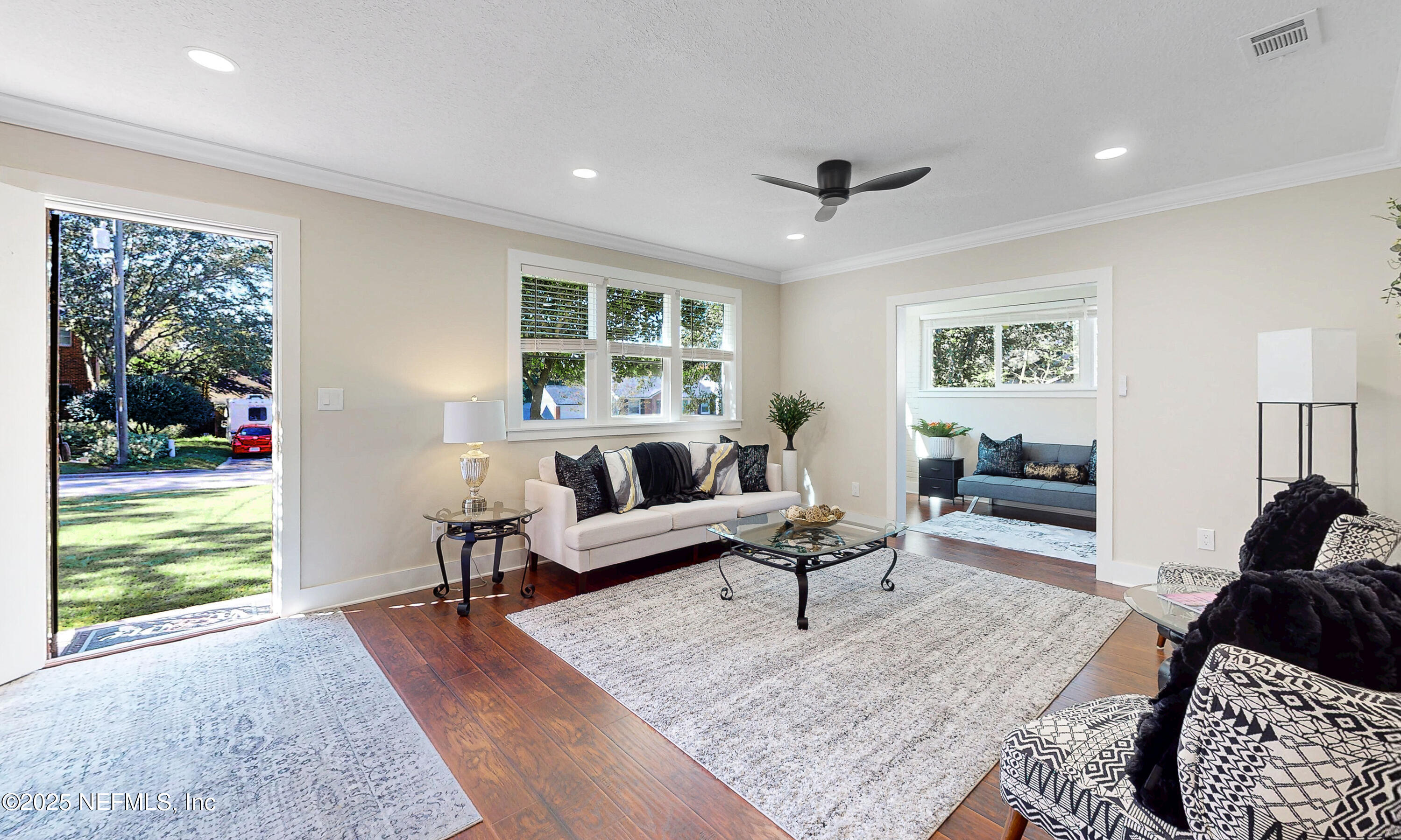 1153 Monticello Road Jacksonville, FL 32207 - Photo 4 of 37 a living room with furniture and a large window