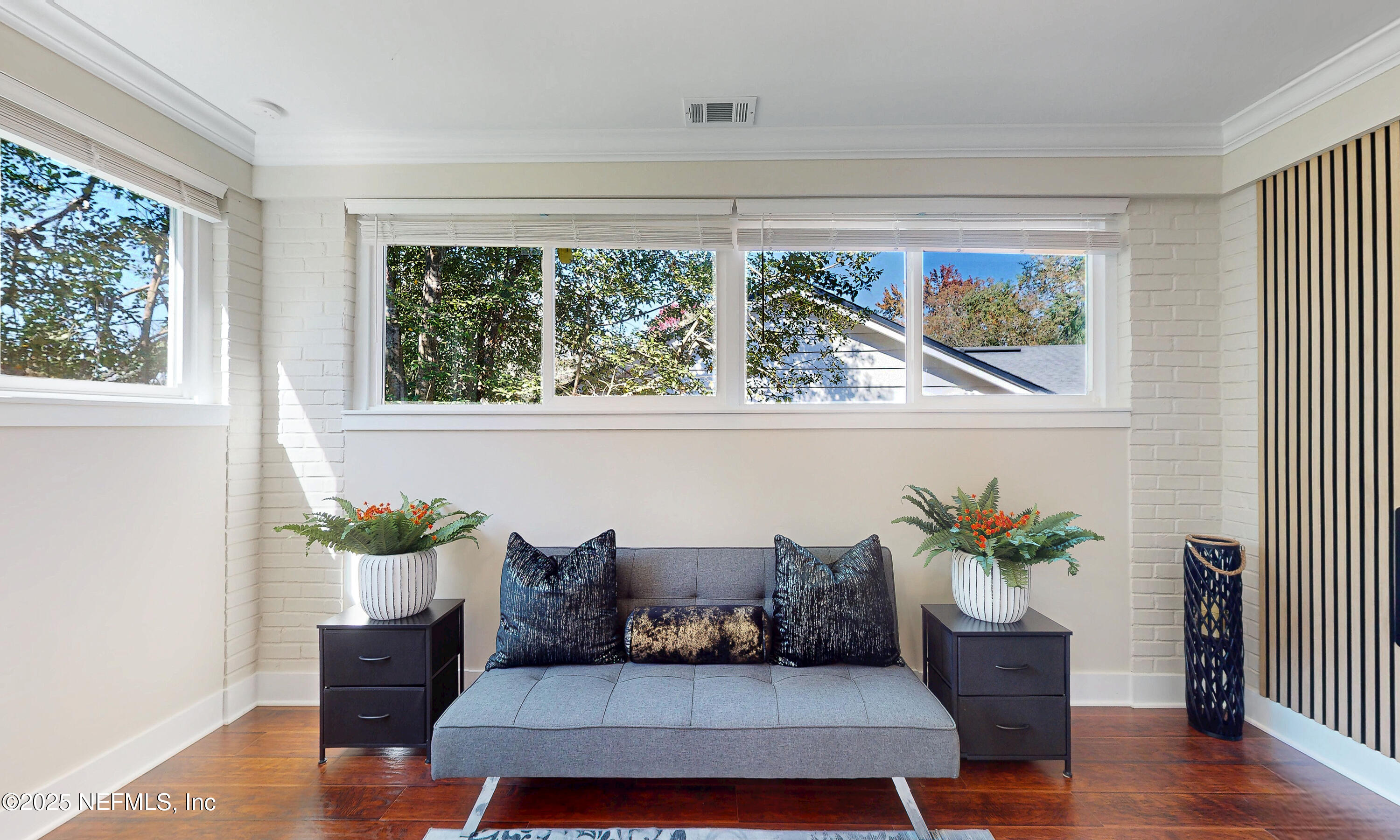 1153 Monticello Road Jacksonville, FL 32207 - Photo 8 of 37 a living room with furniture and a potted plant