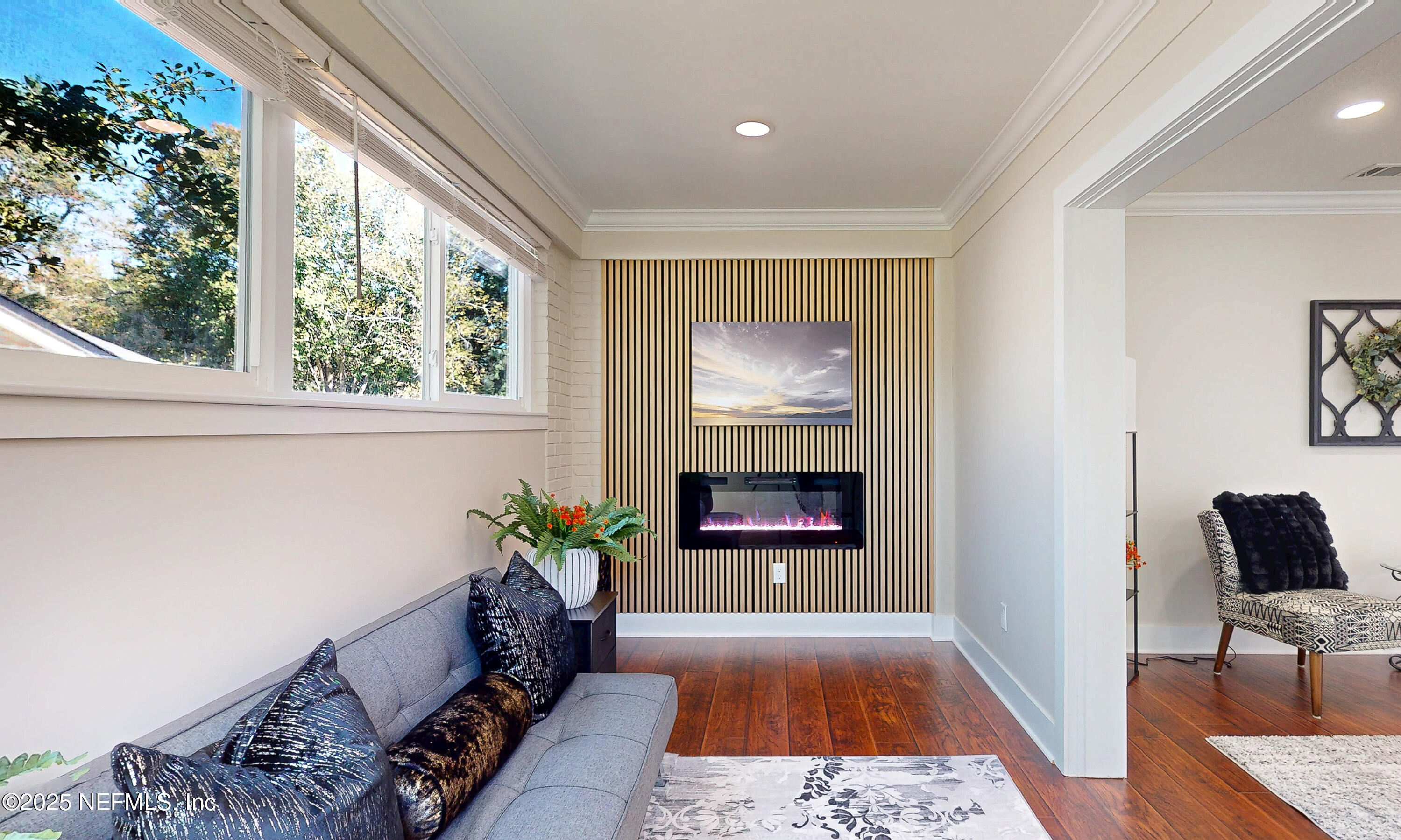 1153 Monticello Road Jacksonville, FL 32207 - Photo 9 of 37 a living room with furniture and a potted plant