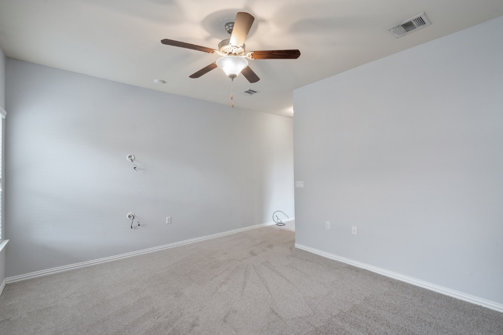 5704 Arbor Hill Lane Austin, TX 78747 - Photo 13 of 32 wooden floor in an empty room