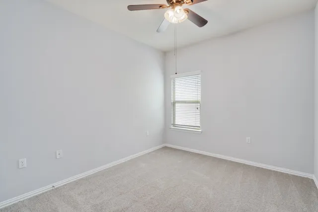 an empty room with white walls and white walls