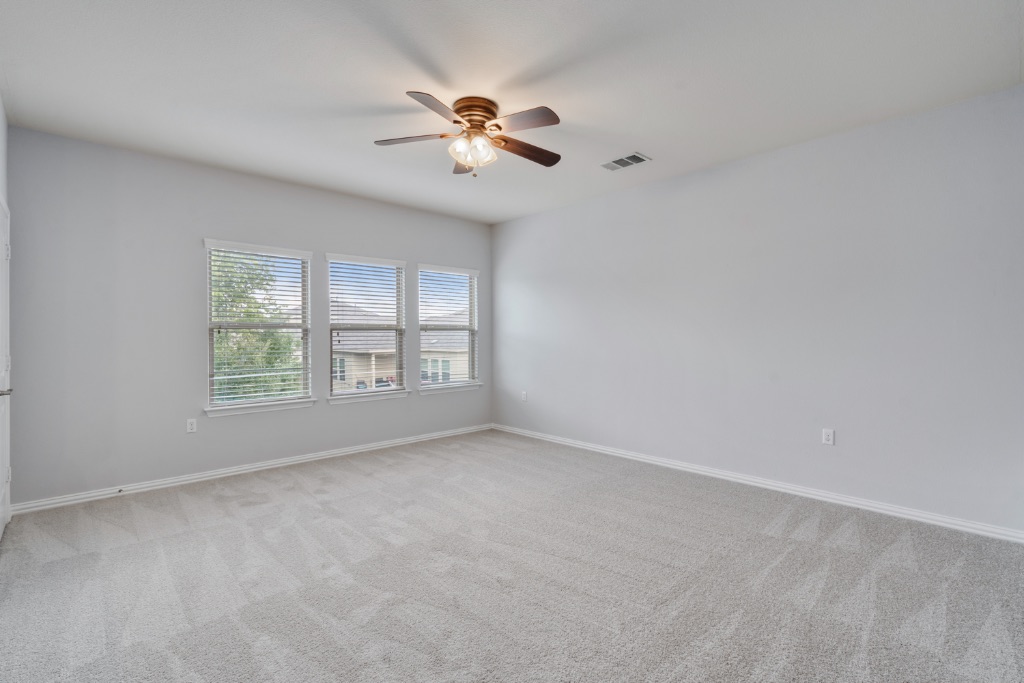 5704 Arbor Hill Lane Austin, TX 78747 - Photo 24 of 32 a view of an empty room with a window