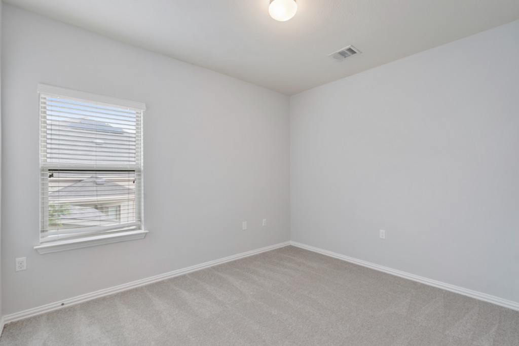 5704 Arbor Hill Lane Austin, TX 78747 - Photo 26 of 32 an empty room with a window
