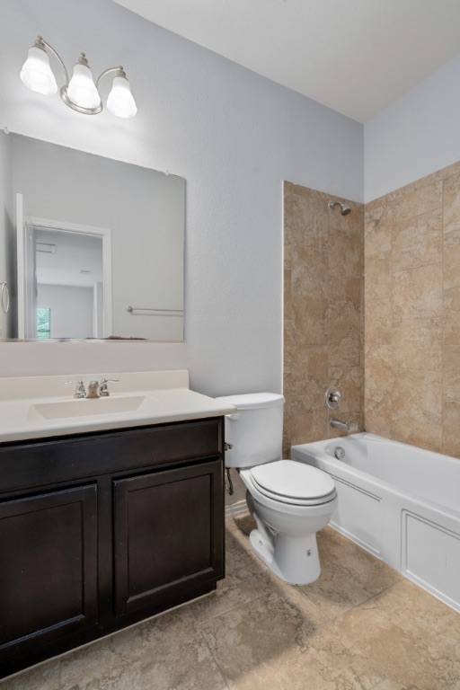 5704 Arbor Hill Lane Austin, TX 78747 - Photo 28 of 32 a bathroom with a sink toilet and a mirror