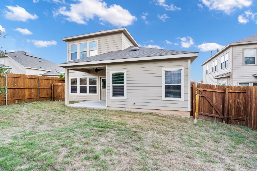5704 Arbor Hill Lane Austin, TX 78747 - Photo 30 of 32 a front view of a house with a garden