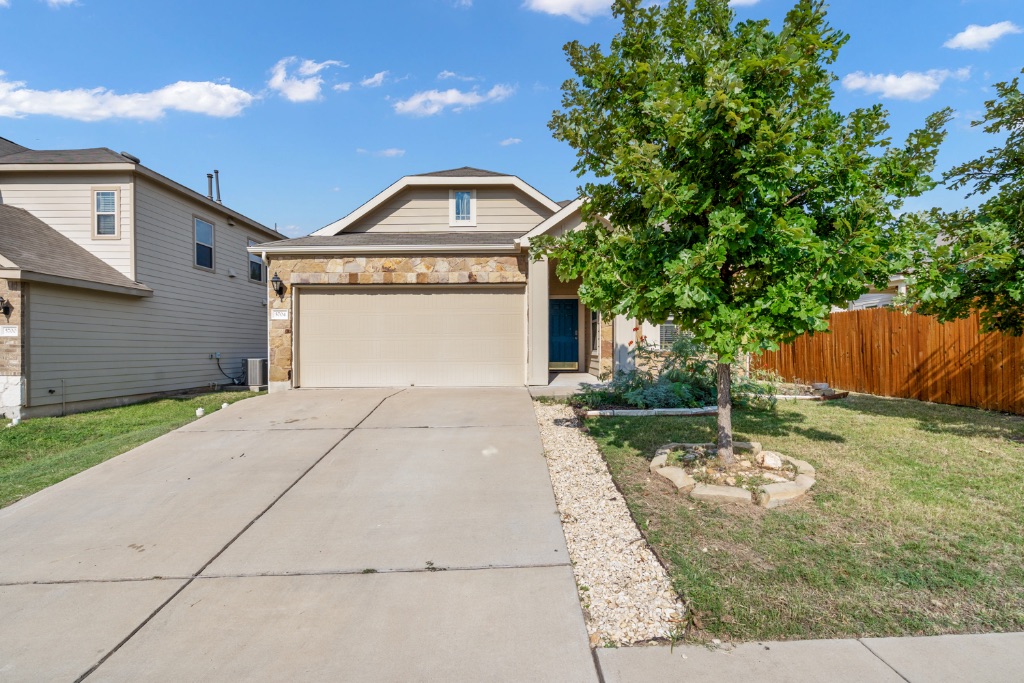 5704 Arbor Hill Lane Austin, TX 78747 - Photo 3 of 32 a front view of a house with garden