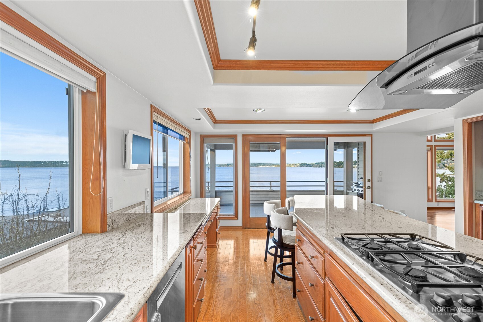 220 Southwest 292nd Street Federal Way, WA 98023 - Photo 11 of 40 a kitchen with stainless steel appliances granite countertop a stove and a view of living room