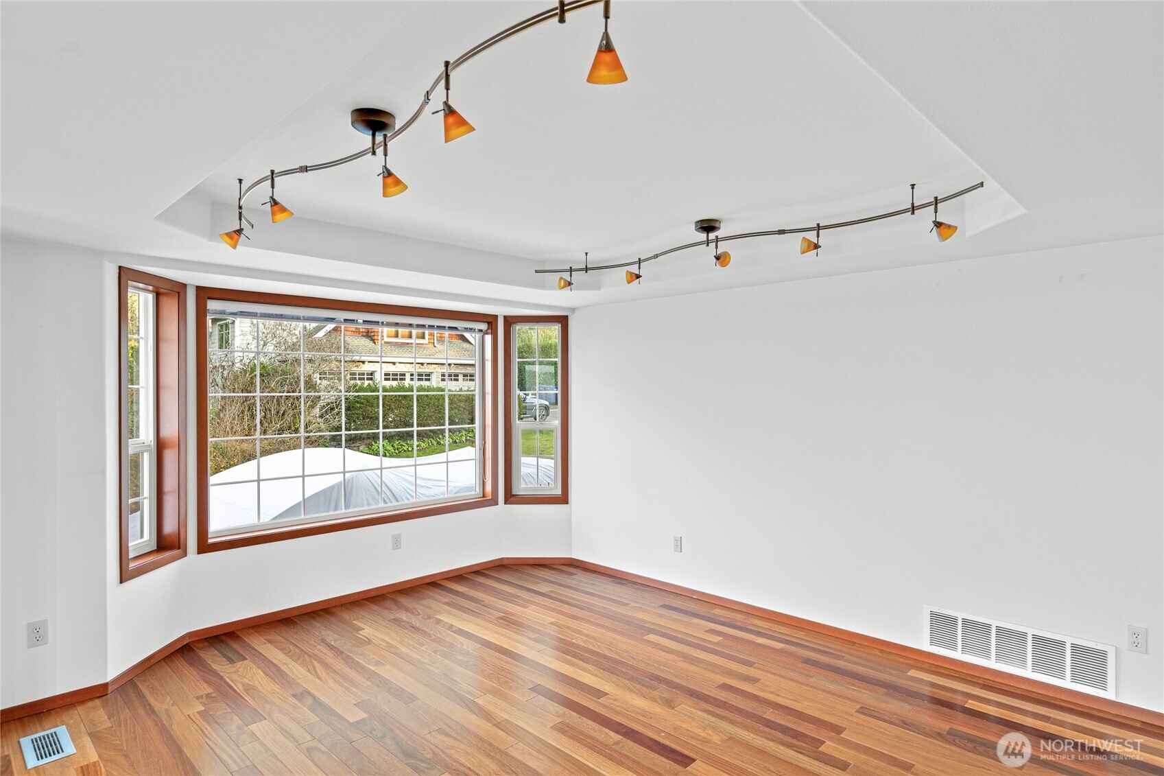 220 Southwest 292nd Street Federal Way, WA 98023 - Photo 14 of 40 a view of an empty room with wooden floor and a window