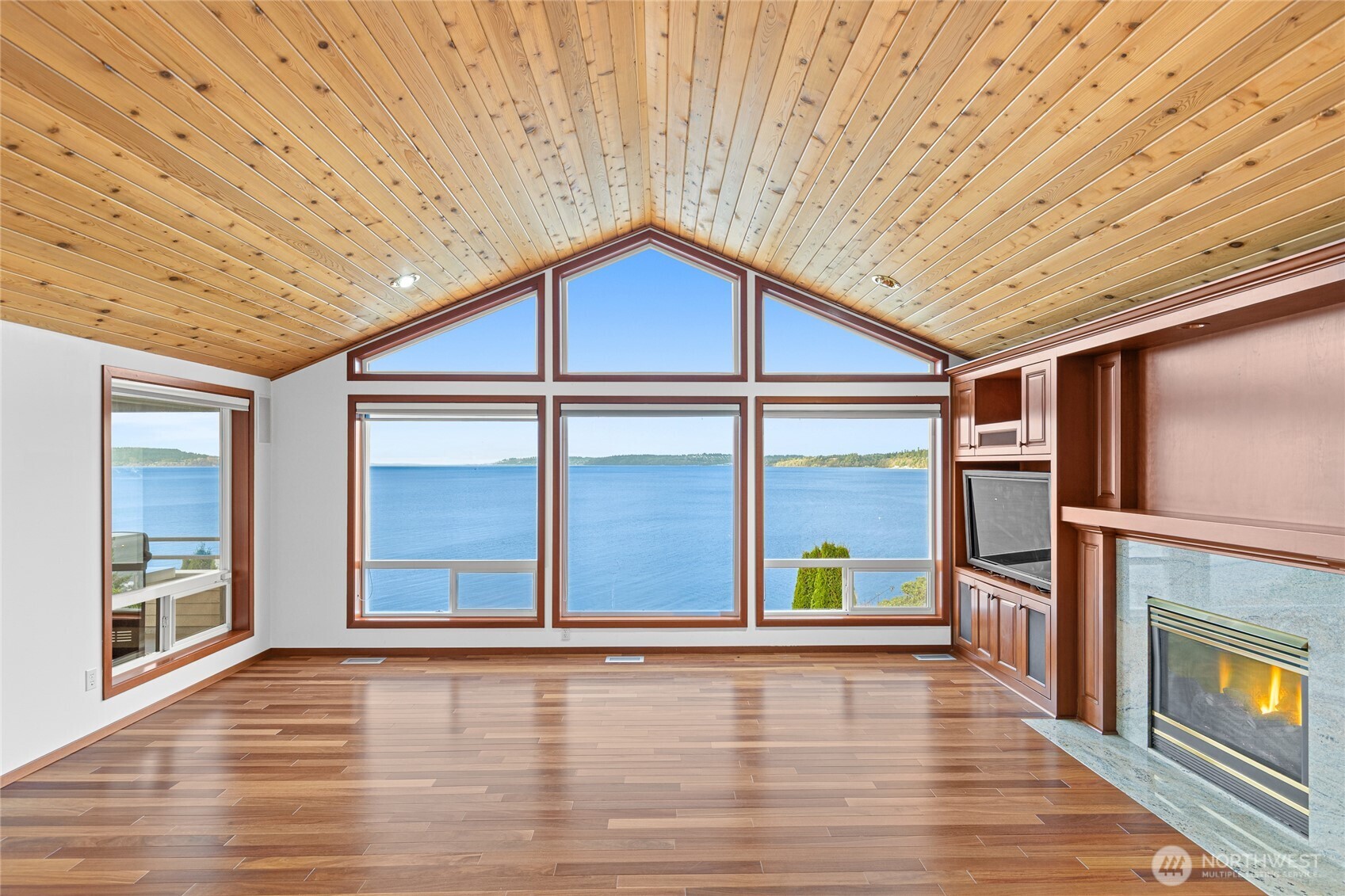 220 Southwest 292nd Street Federal Way, WA 98023 - Photo 6 of 40 a view of an empty room with wooden floor and windows