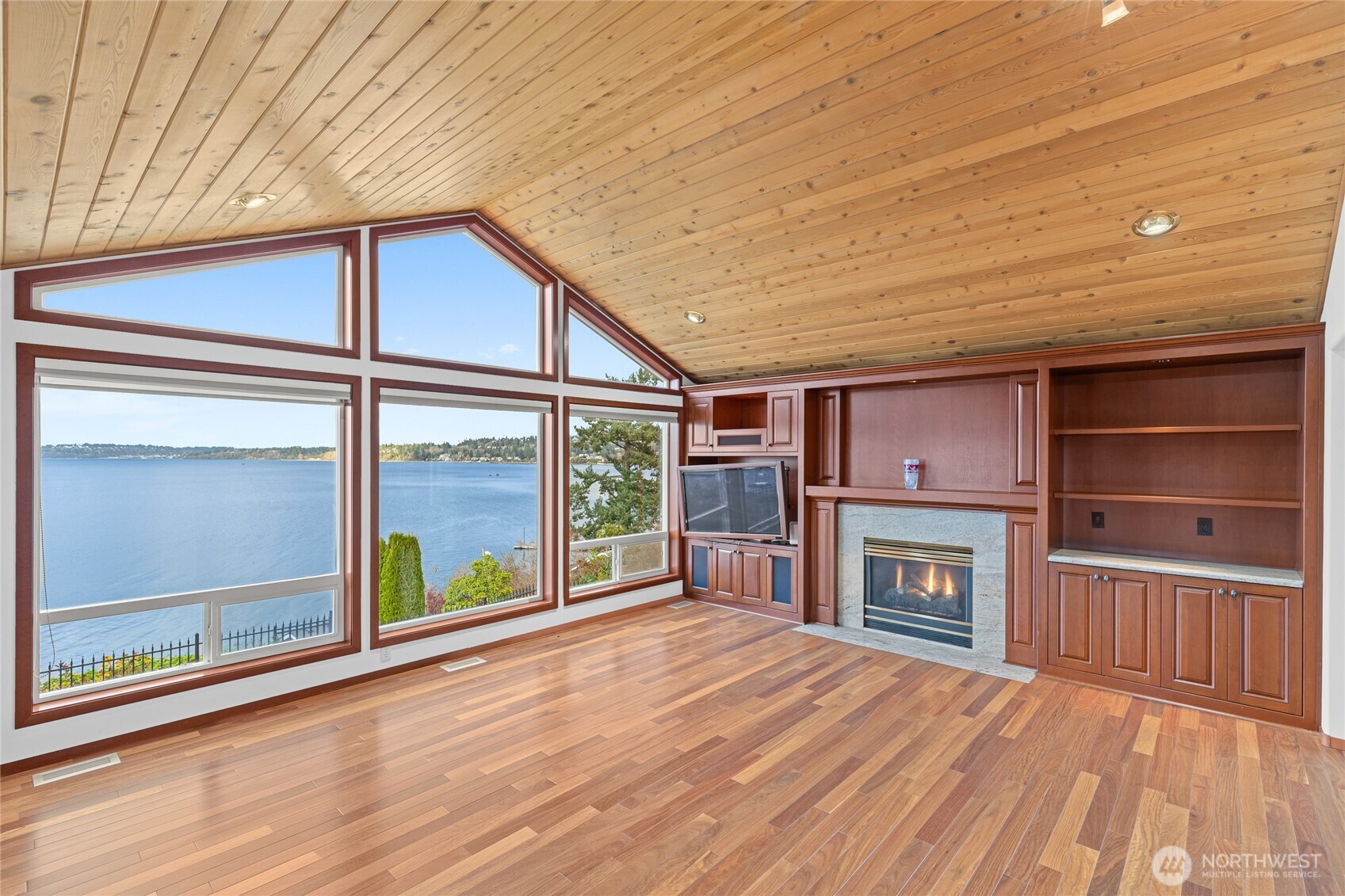 220 Southwest 292nd Street Federal Way, WA 98023 - Photo 7 of 40 a view of an empty room with a fireplace and a window