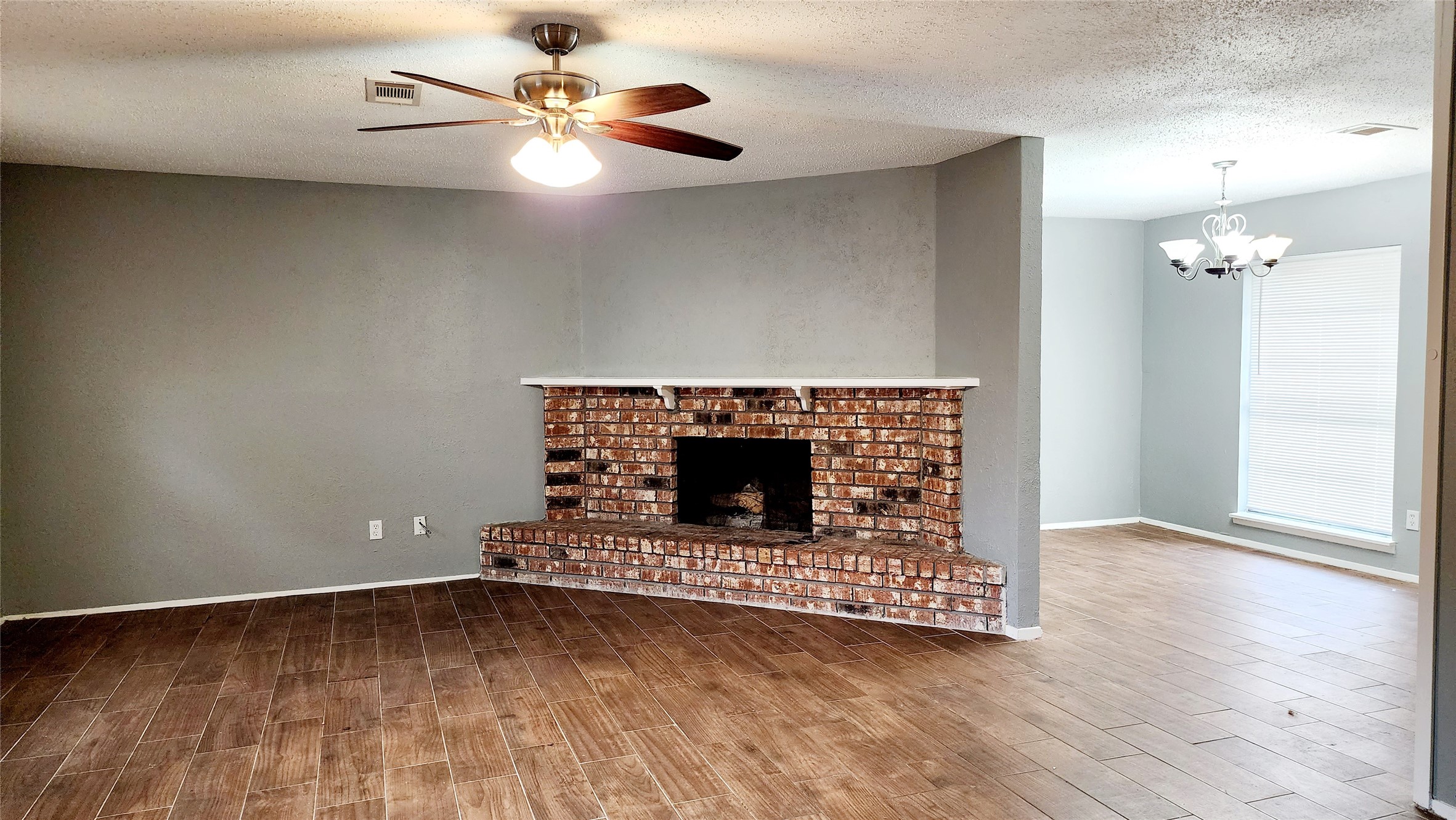 24119 Anchor Ranch Drive Hockley, TX 77447 - Photo 9 of 11 a view of a livingroom with a fireplace a fireplace and wooden floor