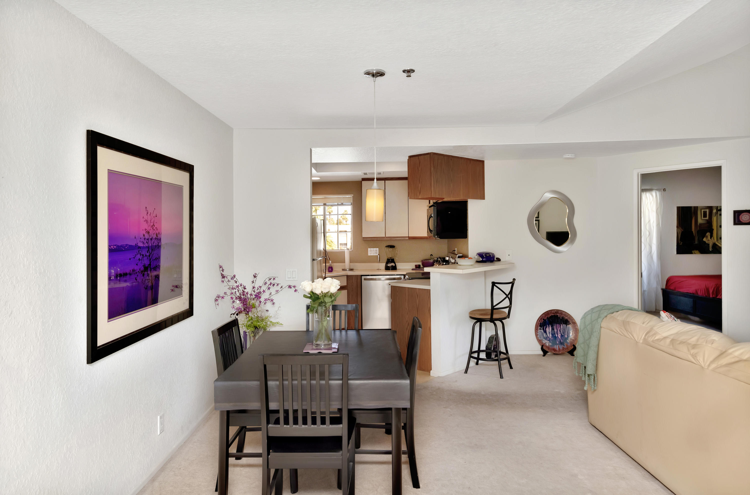 2700 Lawrence Crossley Road, Unit 9 Palm Springs, CA 92264 - Photo 11 of 27 a view of a dining room with furniture and a window