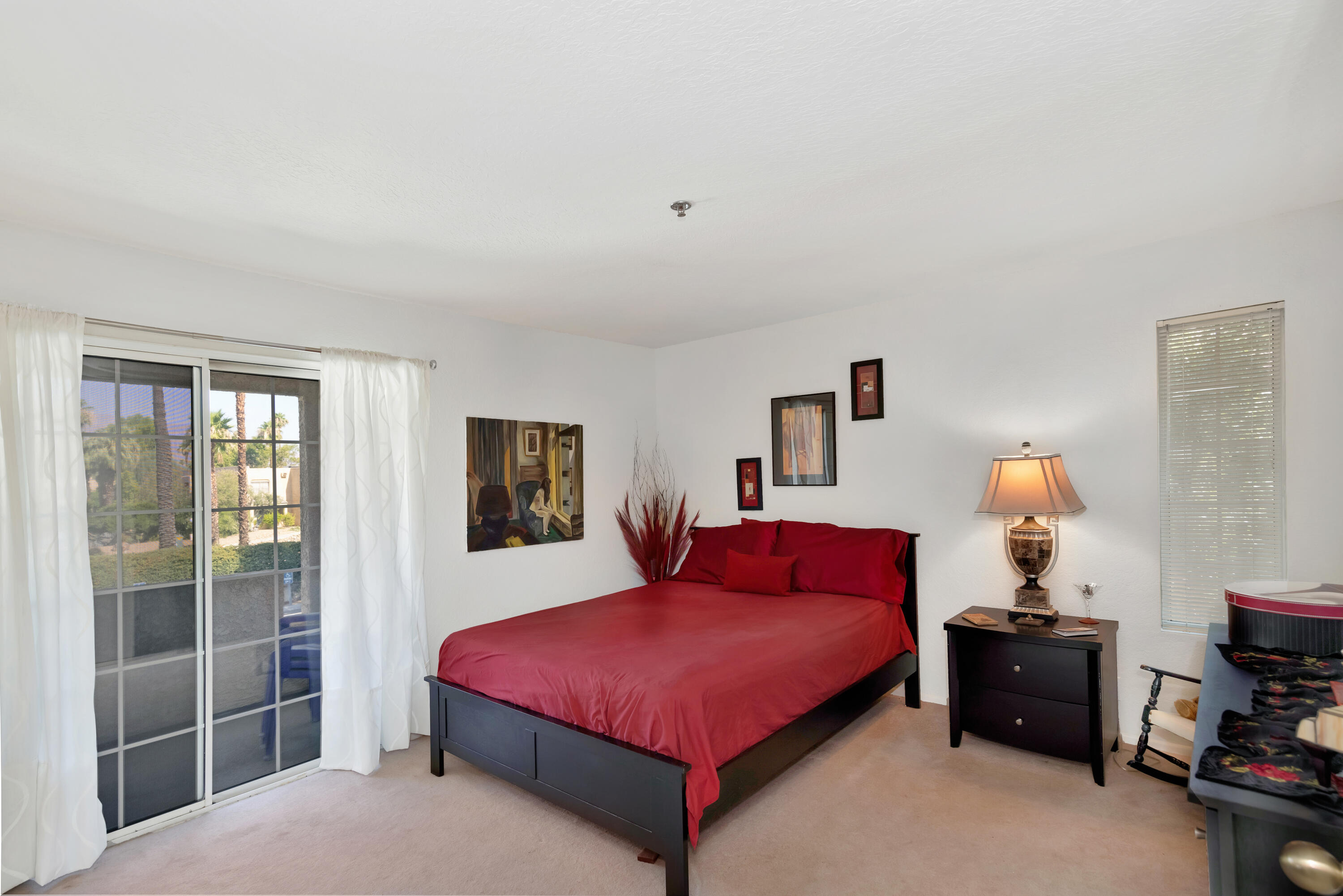 2700 Lawrence Crossley Road, Unit 9 Palm Springs, CA 92264 - Photo 12 of 27 a bedroom with a bed and a window
