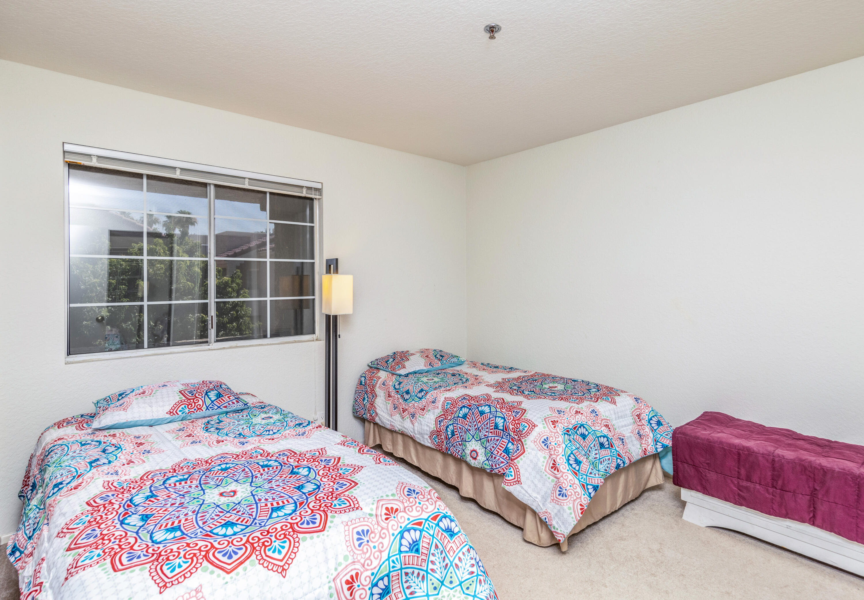 2700 Lawrence Crossley Road, Unit 9 Palm Springs, CA 92264 - Photo 15 of 27 a bedroom with two large bed and a window