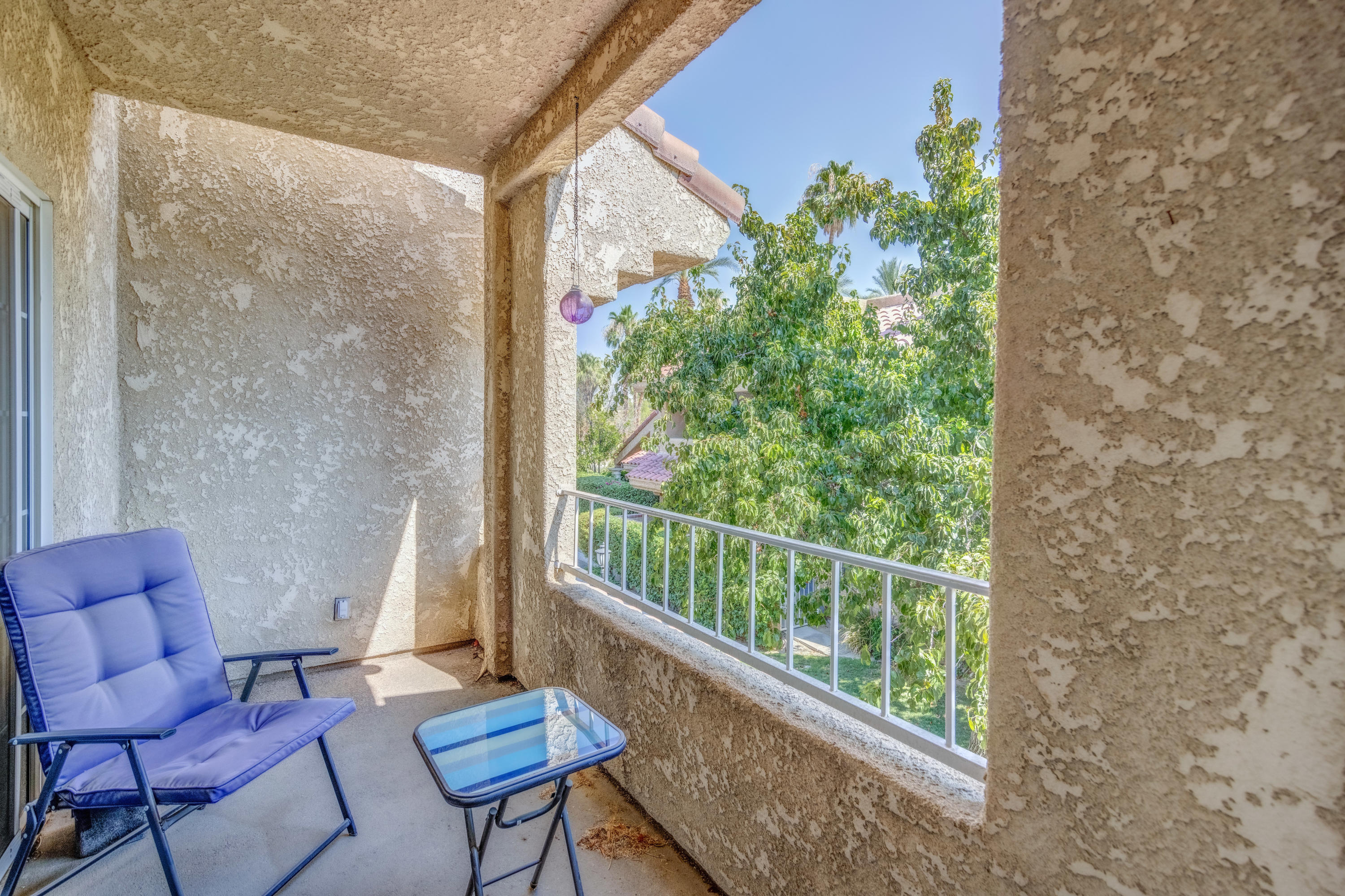 2700 Lawrence Crossley Road, Unit 9 Palm Springs, CA 92264 - Photo 19 of 27 a view of a chairs in balcony