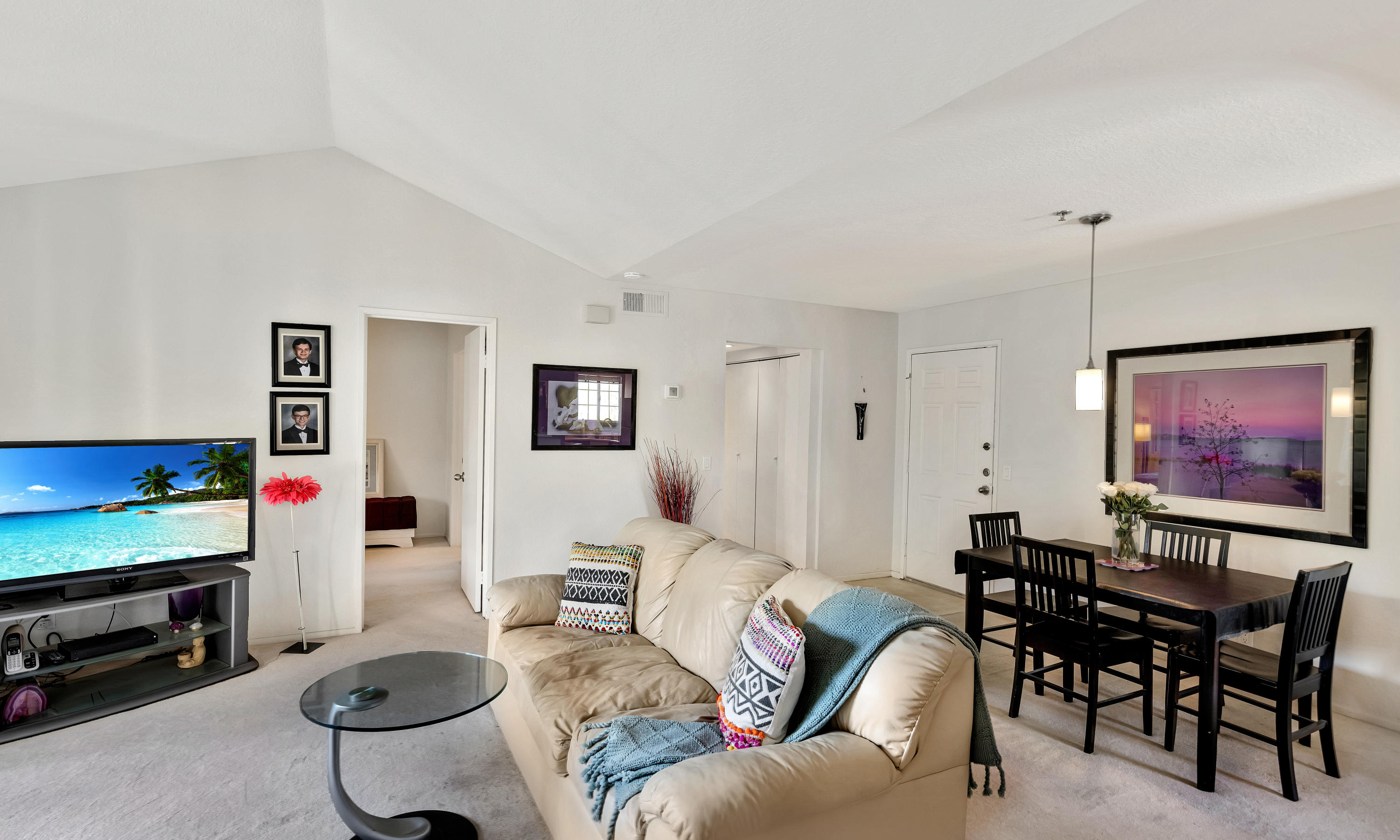 2700 Lawrence Crossley Road, Unit 9 Palm Springs, CA 92264 - Photo 3 of 27 a living room with furniture a air conditioner and a window