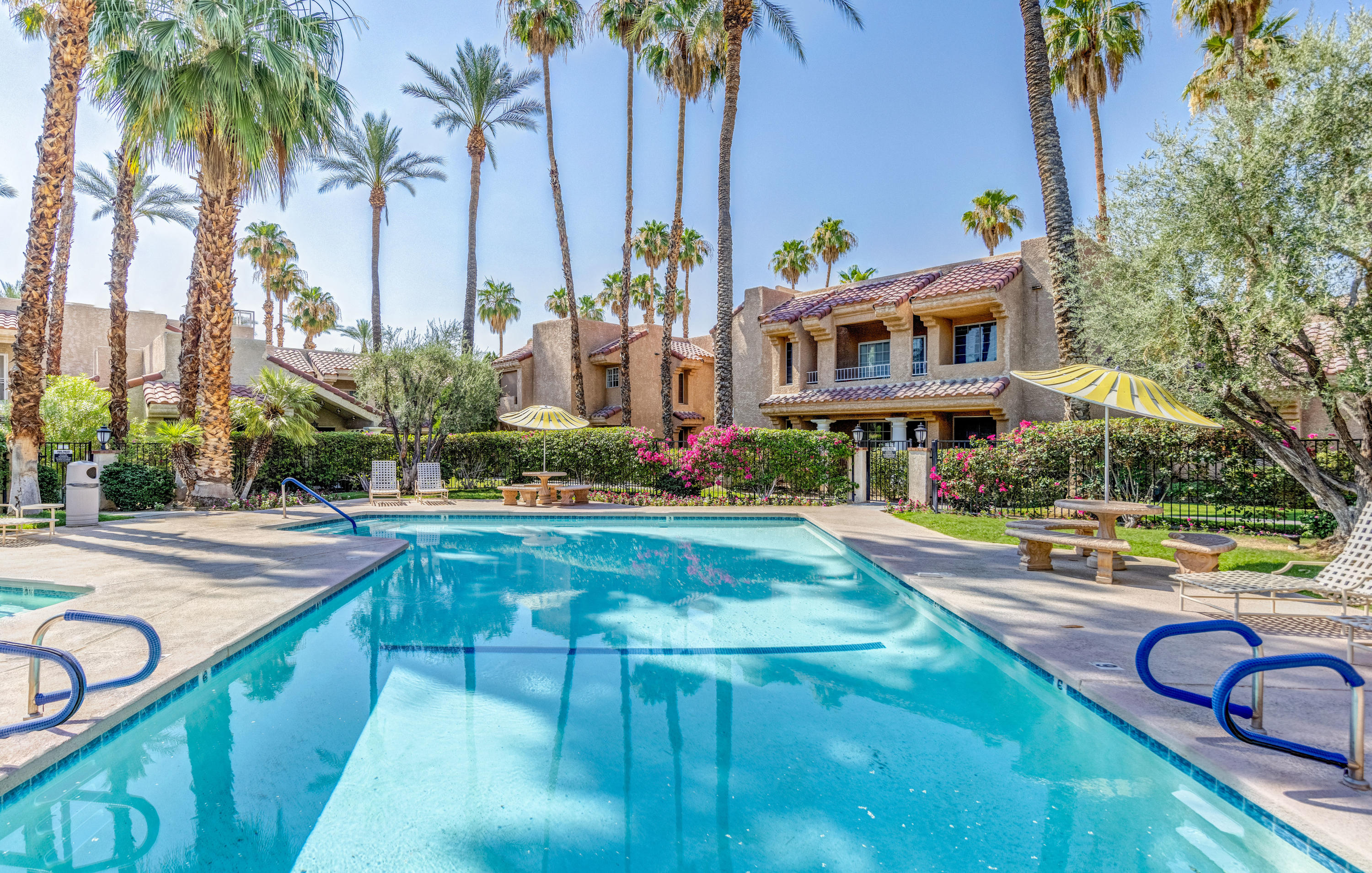 2700 Lawrence Crossley Road, Unit 9 Palm Springs, CA 92264 - Photo 22 of 27 a front view of house with yard and swimming pool