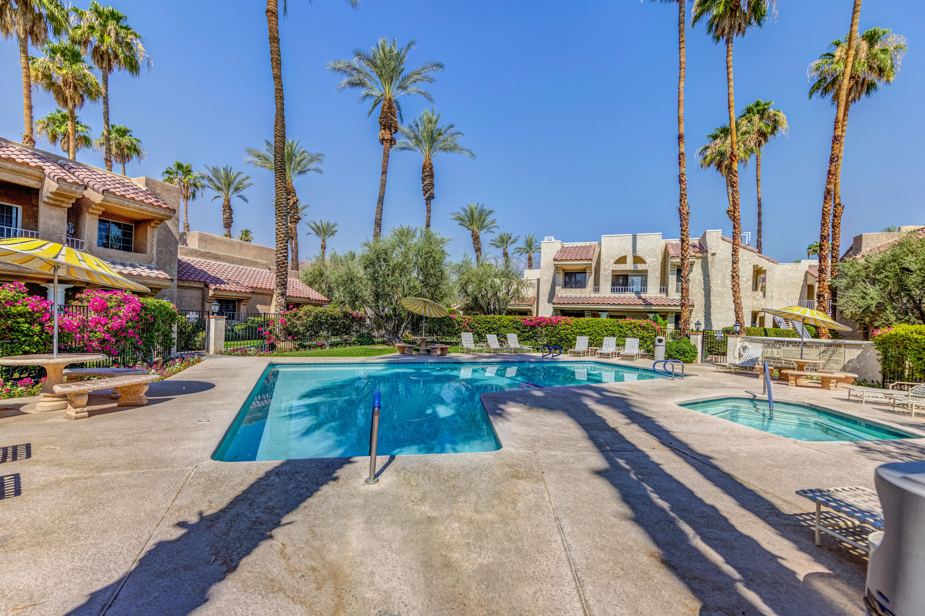 2700 Lawrence Crossley Road, Unit 9 Palm Springs, CA 92264 - Photo 24 of 27 a view of a swimming pool with a patio and a yard