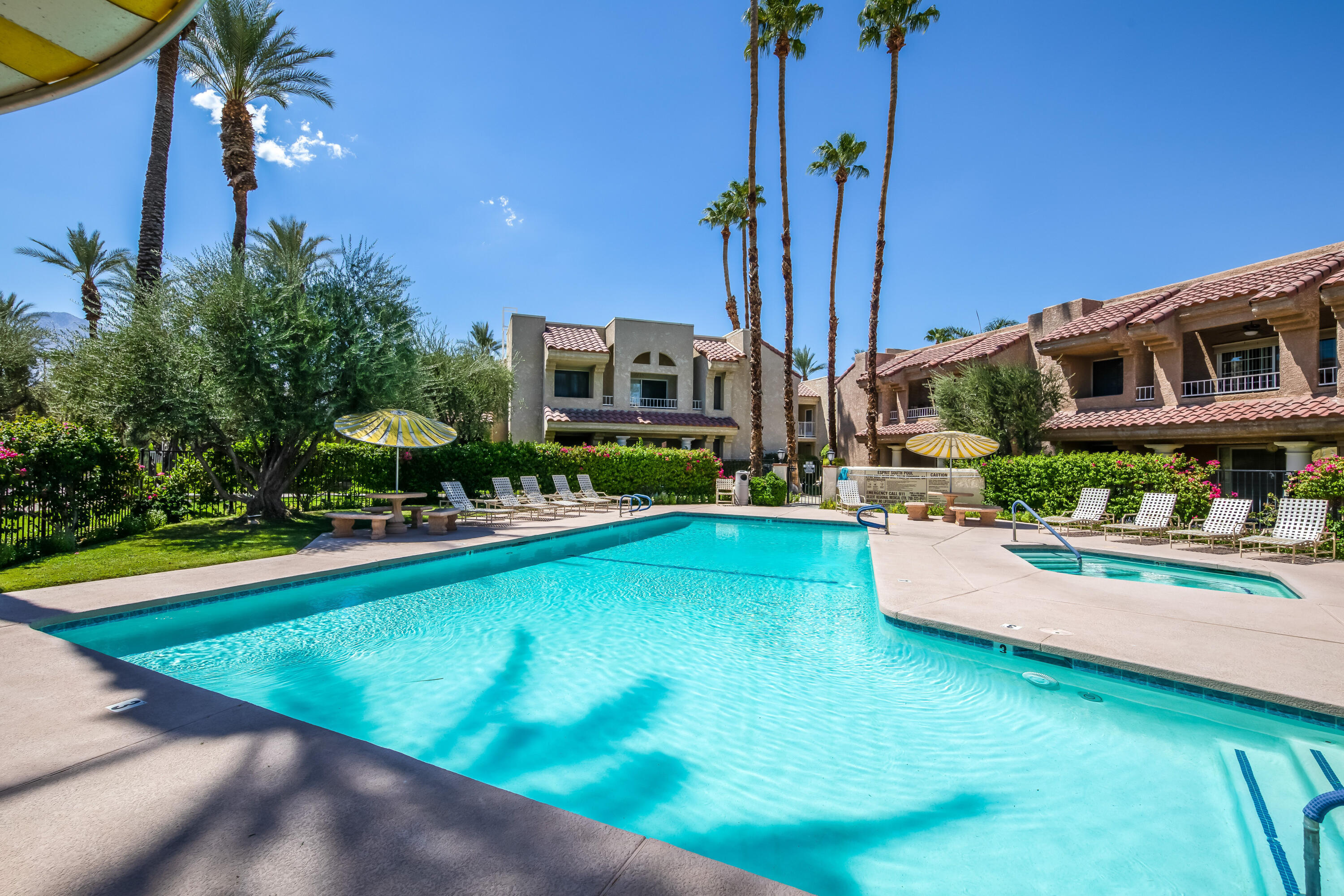 2700 Lawrence Crossley Road, Unit 9 Palm Springs, CA 92264 - Photo 25 of 27 a view of a house with swimming pool and sitting area