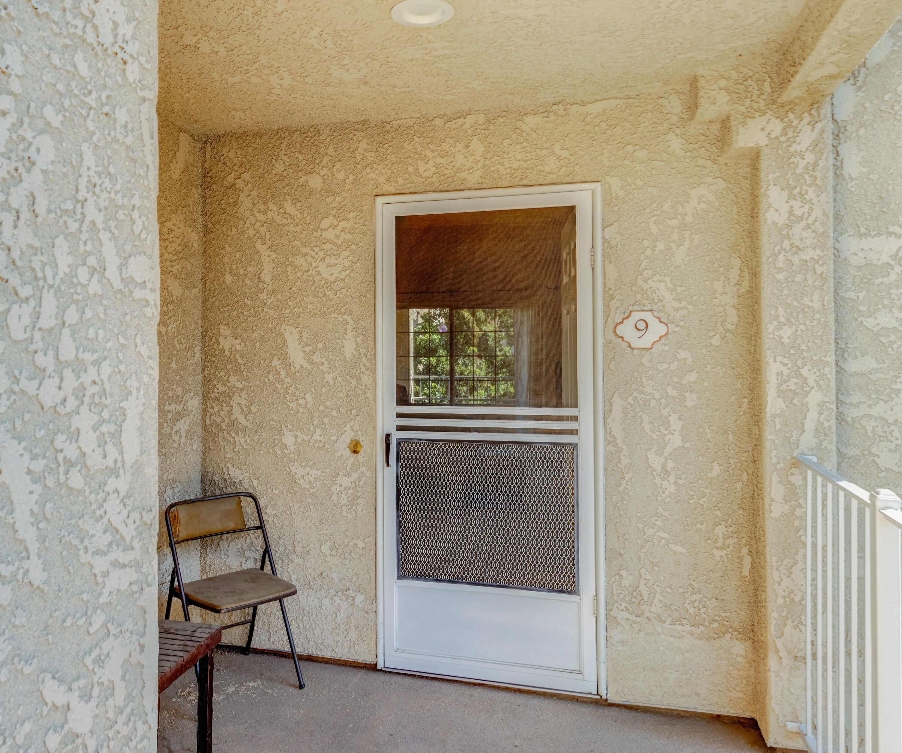 2700 Lawrence Crossley Road, Unit 9 Palm Springs, CA 92264 - Photo 27 of 27 a view of a hallway with windows