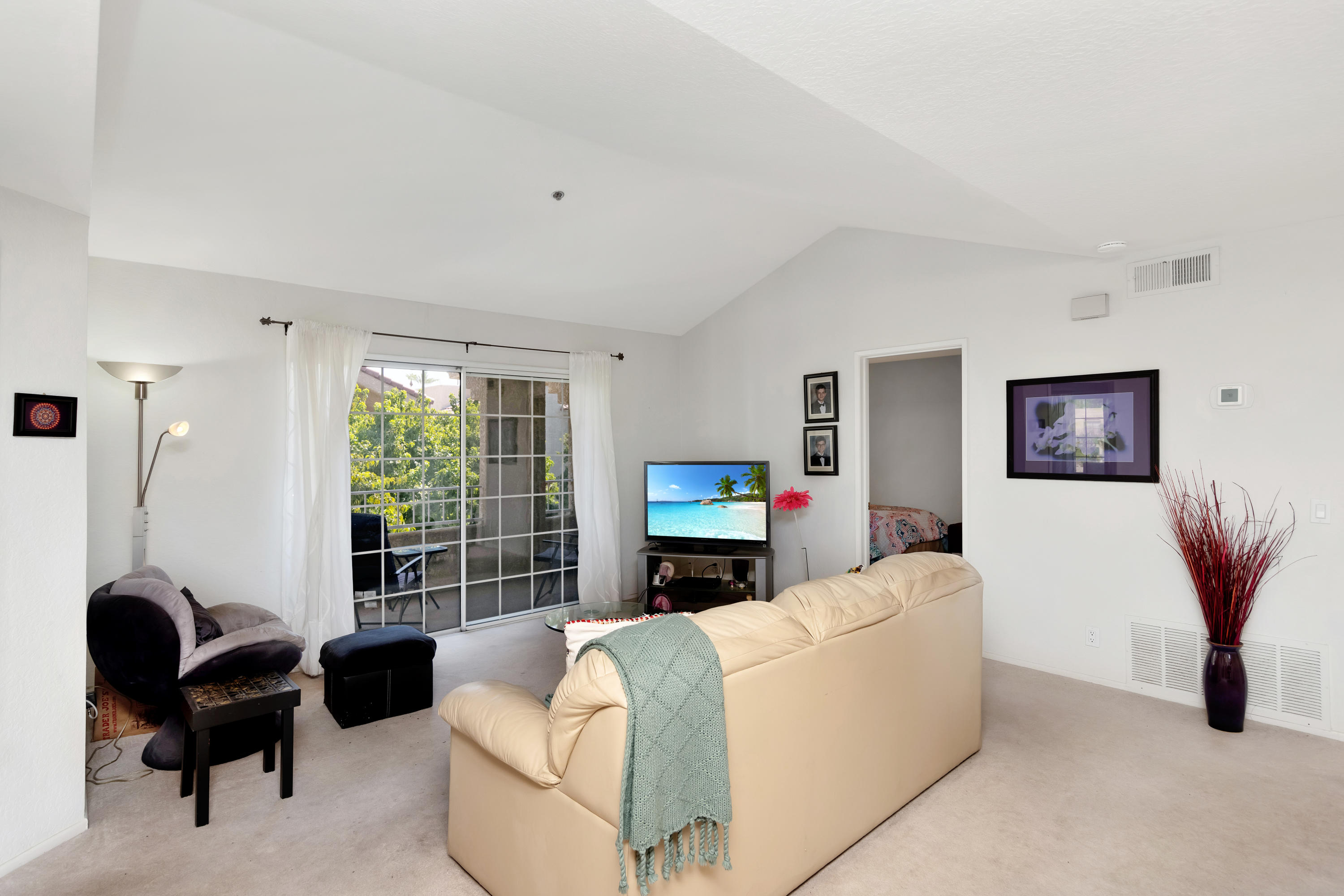 2700 Lawrence Crossley Road, Unit 9 Palm Springs, CA 92264 - Photo 5 of 27 a living room with furniture and a flat screen tv