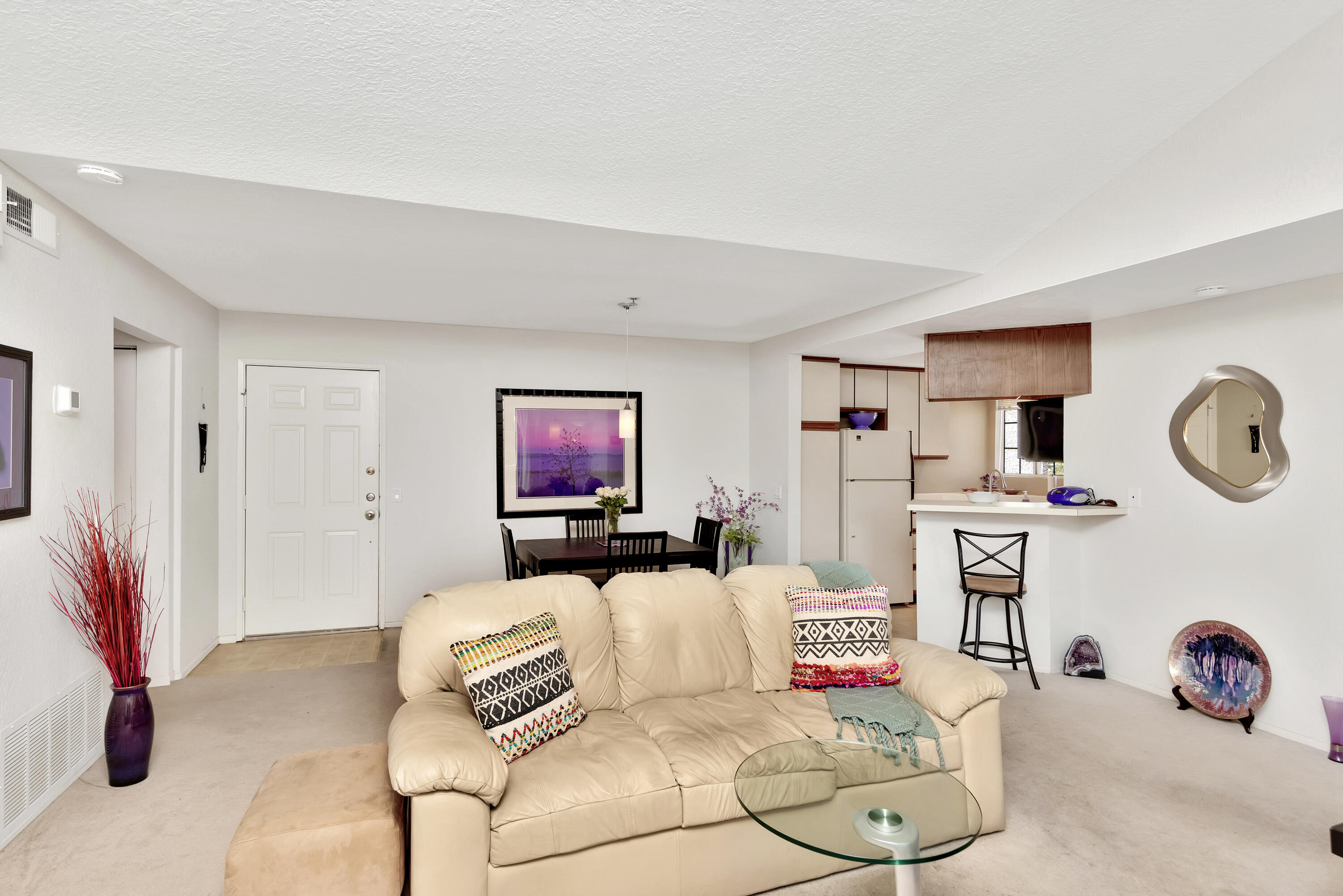 2700 Lawrence Crossley Road, Unit 9 Palm Springs, CA 92264 - Photo 6 of 27 a living room with furniture and a flat screen tv