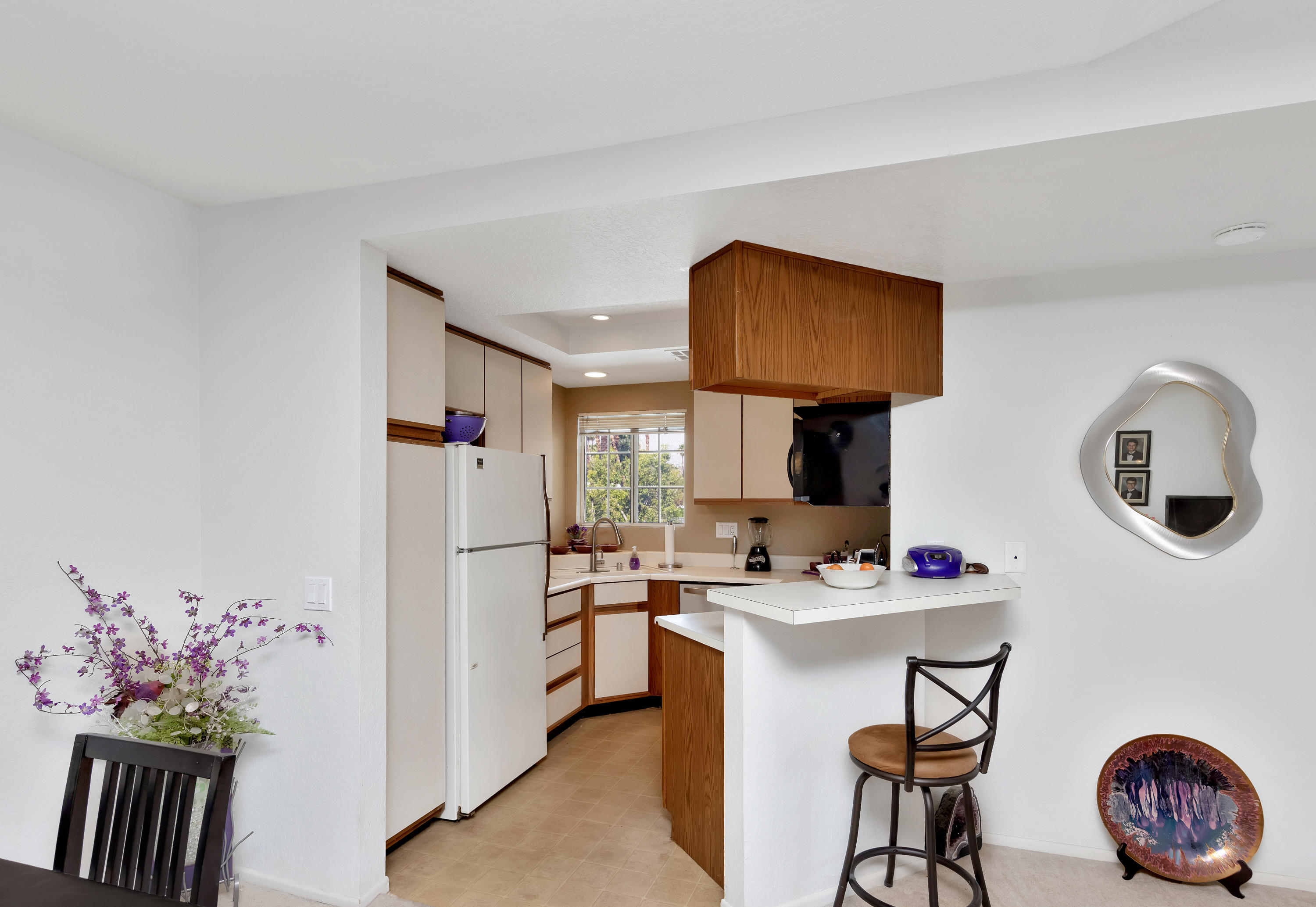 2700 Lawrence Crossley Road, Unit 9 Palm Springs, CA 92264 - Photo 7 of 27 a kitchen with granite countertop a sink cabinets and stainless steel appliances