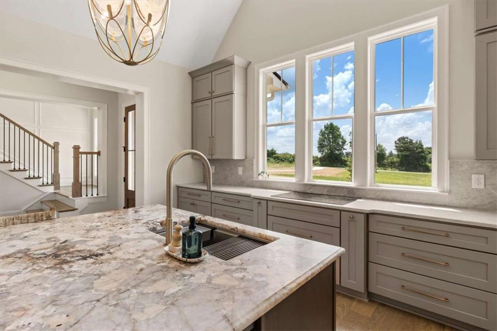 591 Welcome Road Roopville, GA 30170 - Photo 13 of 60 a kitchen with a sink and a window