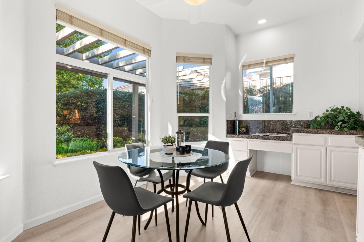 8750 McCarty Ranch Drive San Jose, CA 95135 - Photo 16 of 59 a dining room with furniture a chandelier and wooden floor