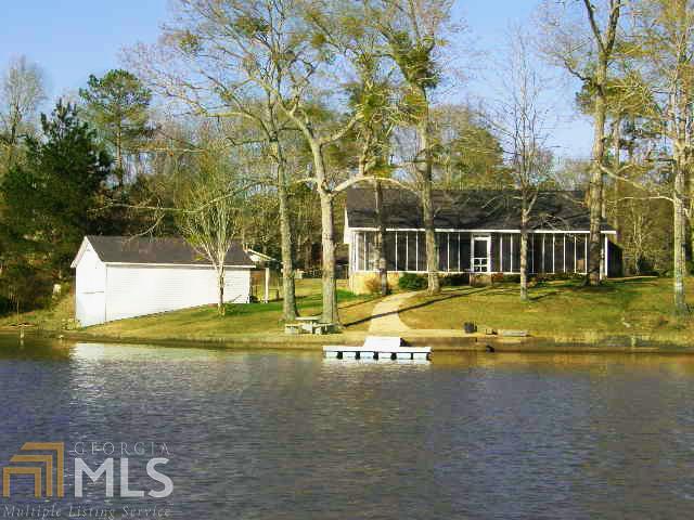636 Lee Road, Unit 367 Salem, AL 36854 - Photo 1 of 1 a view of a swimming pool with a yard and large trees