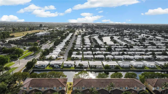 an aerial view of residential houses with city view