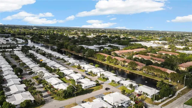 an aerial view of a house with sitting space and garden