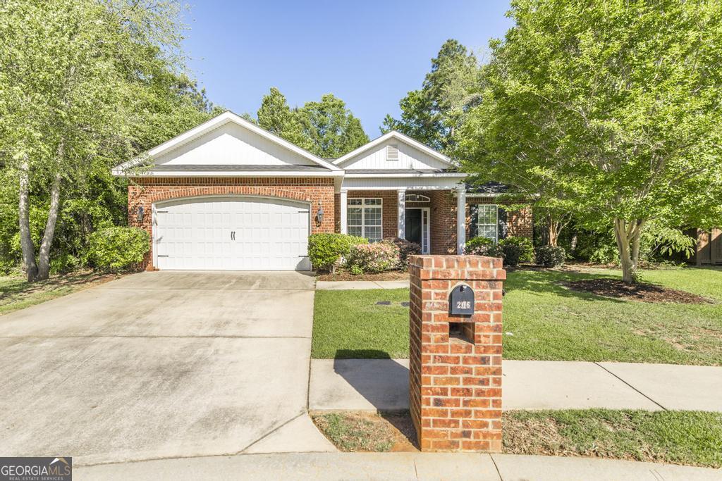 206 Londe Lane Perry, GA 31069 - Photo 1 of 37 a front view of a house with a garden