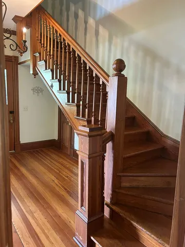 a view of entryway with wooden floor