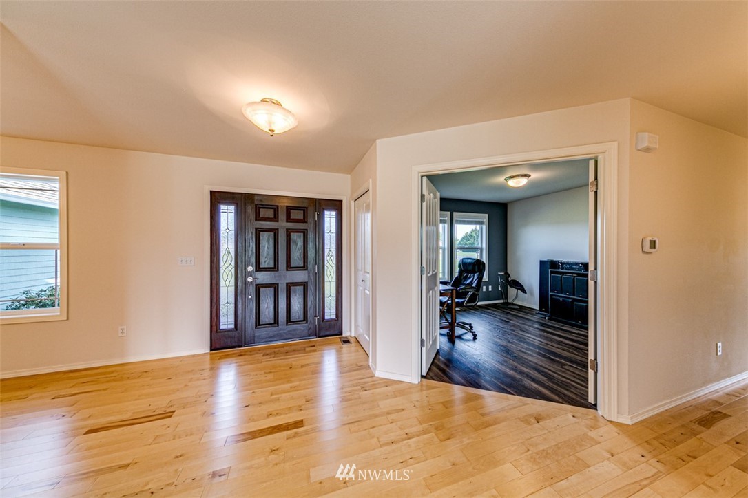 72 Buckhorn Road Sequim, WA 98382 - Photo 22 of 40 a view of a livingroom with wooden floor and furniture