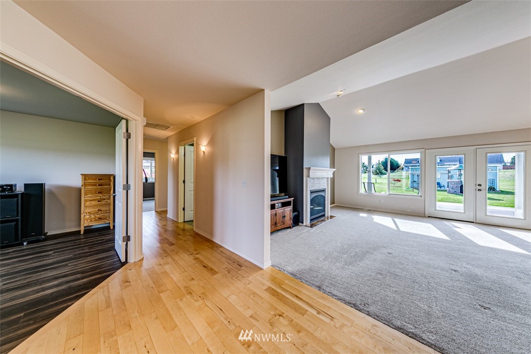 72 Buckhorn Road Sequim, WA 98382 - Photo 5 of 40 a spacious bedroom with a large bed and a large window