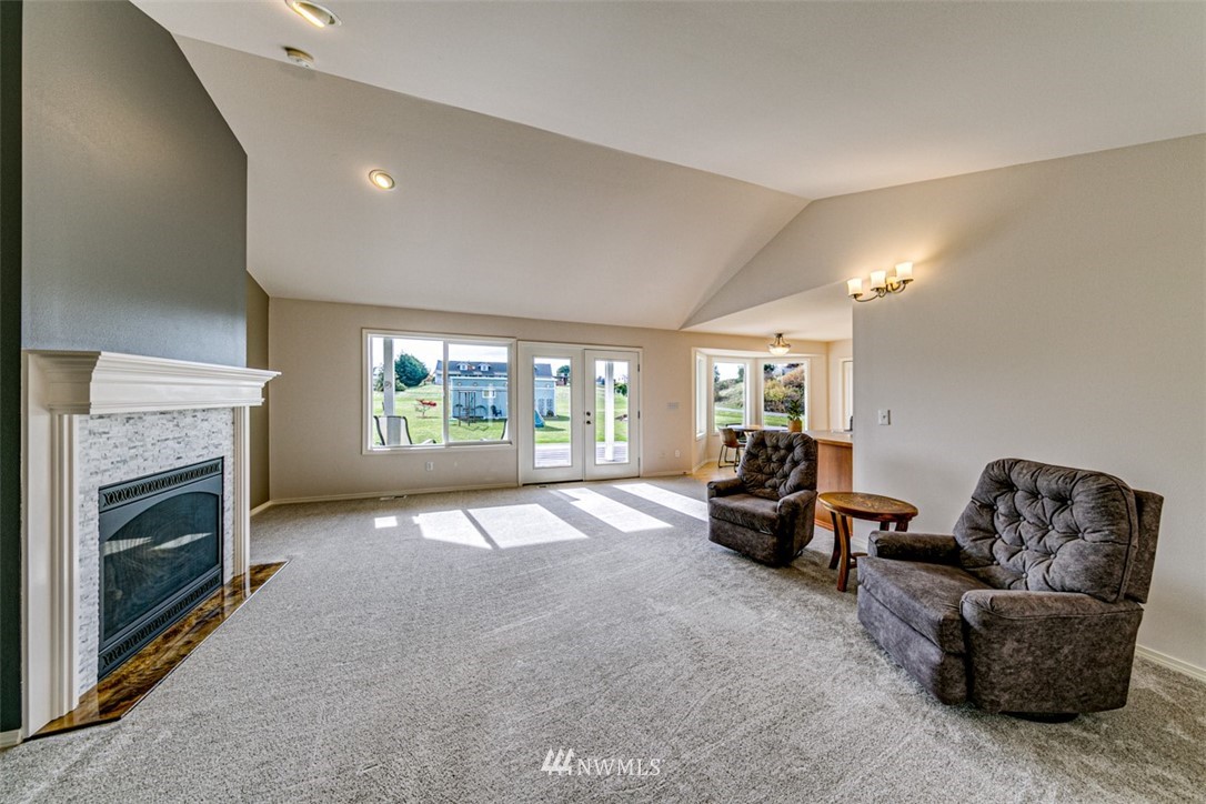 72 Buckhorn Road Sequim, WA 98382 - Photo 6 of 40 a living room with furniture and a fireplace