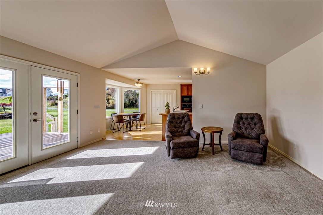 72 Buckhorn Road Sequim, WA 98382 - Photo 8 of 40 a spacious bedroom with a bed and large windows
