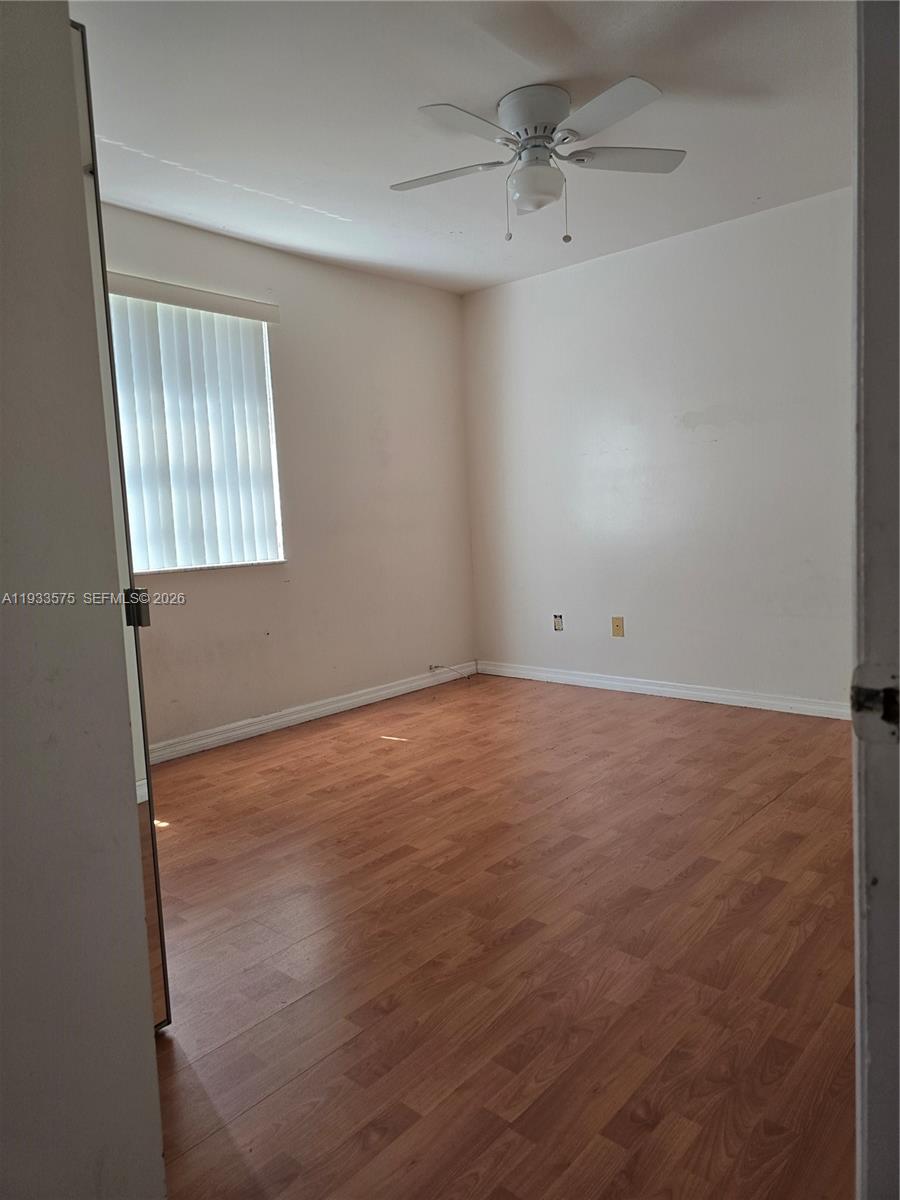 12687 Southwest 146th Street Miami, FL 33186 - Photo 11 of 20 an empty room with a window