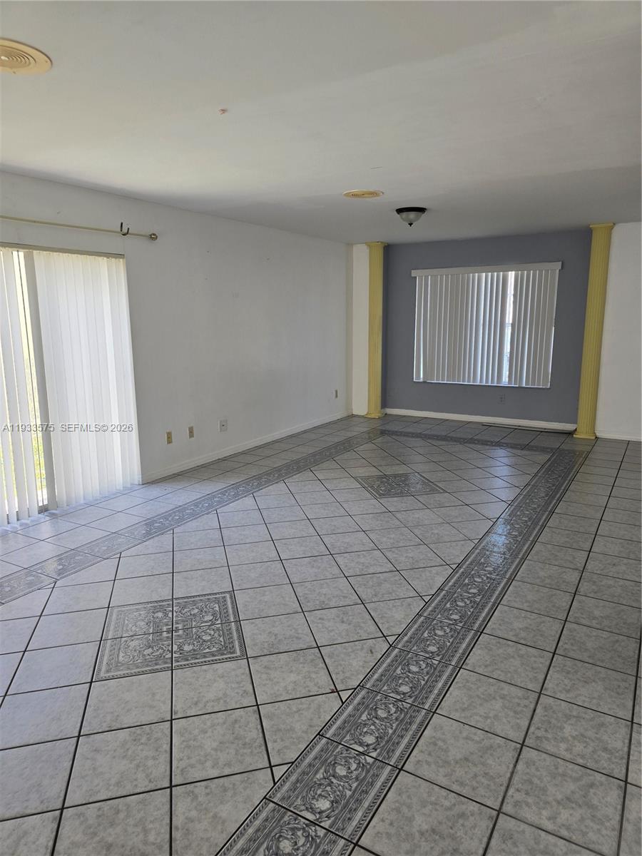 12687 Southwest 146th Street Miami, FL 33186 - Photo 13 of 20 a view of an empty room and window