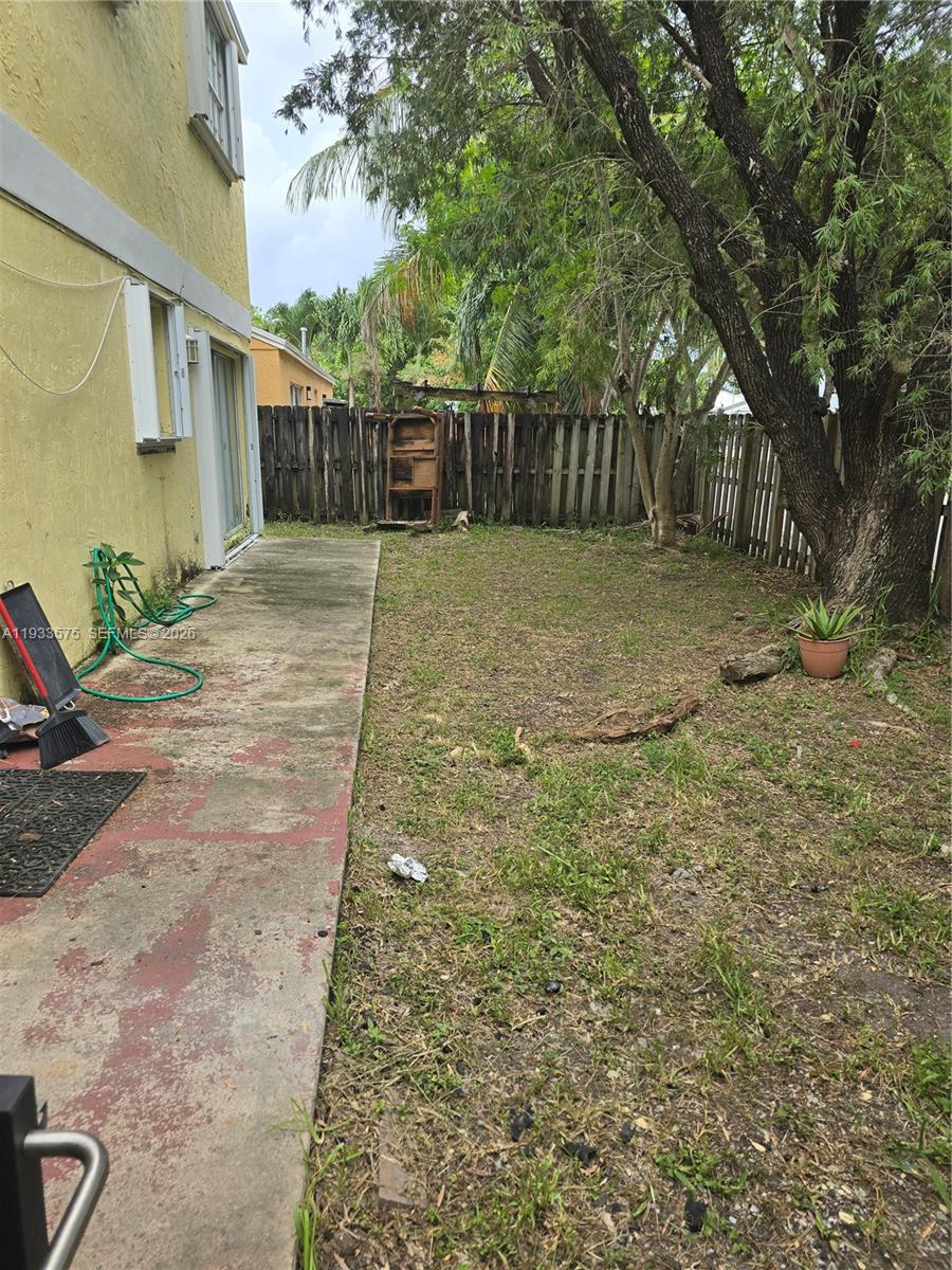 12687 Southwest 146th Street Miami, FL 33186 - Photo 5 of 20 a view of a backyard with large trees