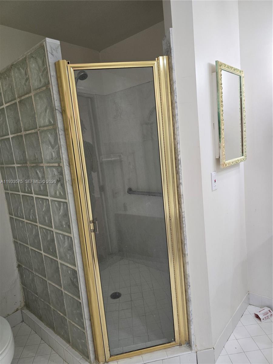 12687 Southwest 146th Street Miami, FL 33186 - Photo 8 of 20 a bathroom with a shower and a toilet