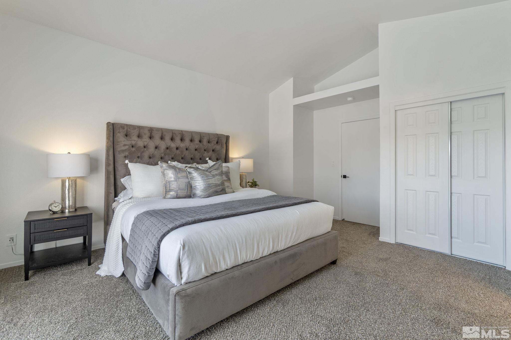 2332 Madera Court Reno, NV 89523 - Photo 22 of 36 a bedroom with a bed and a night lamp