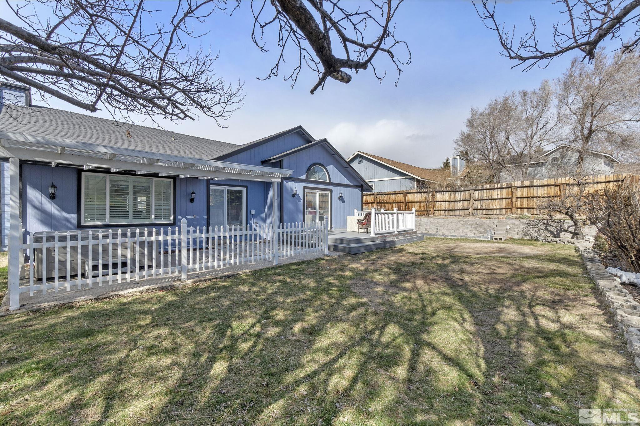 2332 Madera Court Reno, NV 89523 - Photo 33 of 36 a view of a house with a small yard and wooden fence