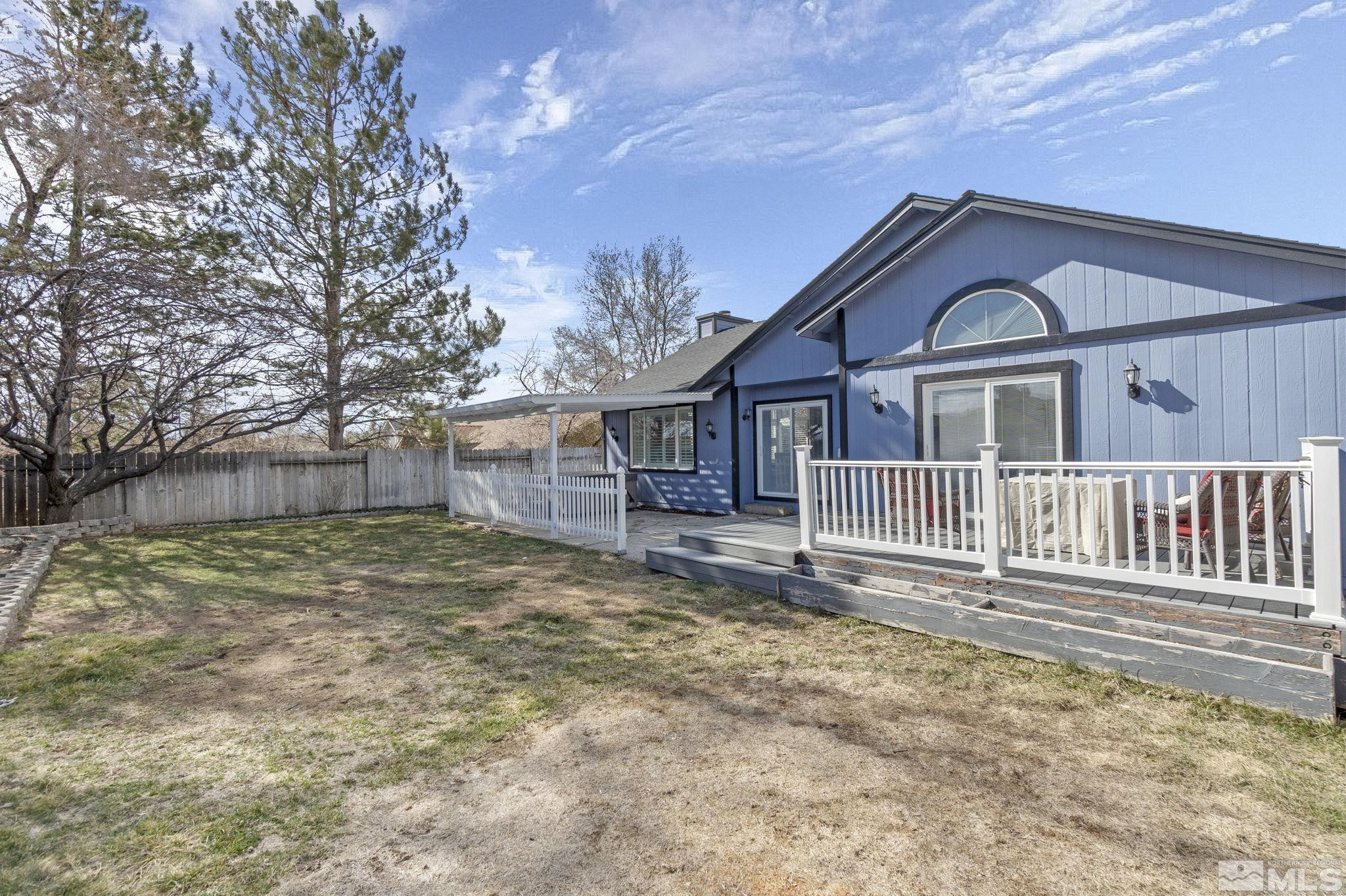 2332 Madera Court Reno, NV 89523 - Photo 34 of 36 a view of a house with a small yard and wooden fence