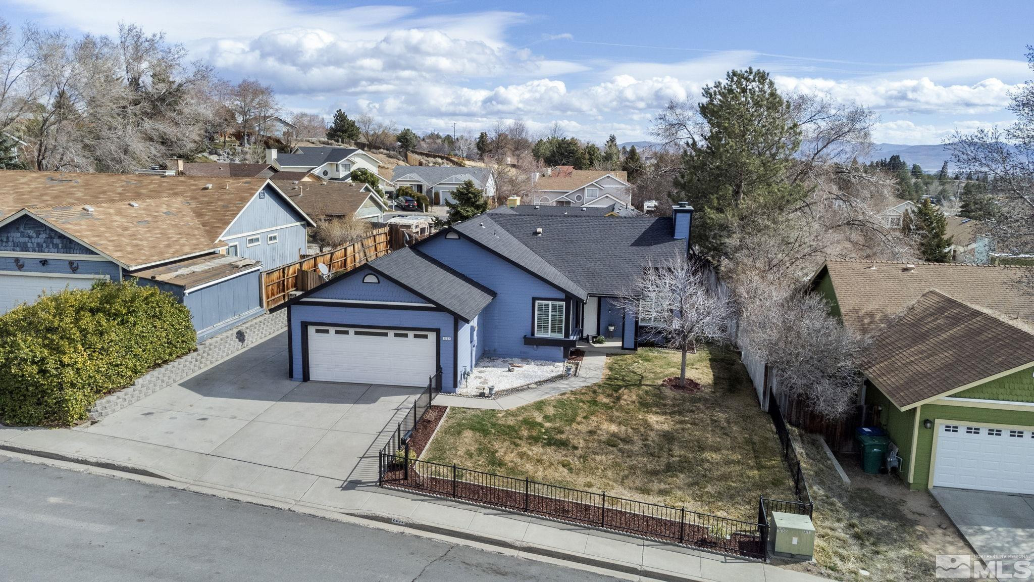 2332 Madera Court Reno, NV 89523 - Photo 4 of 36 a front view of a house with large trees