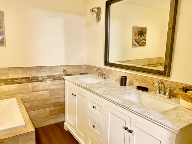 a bathroom with a sink and a mirror