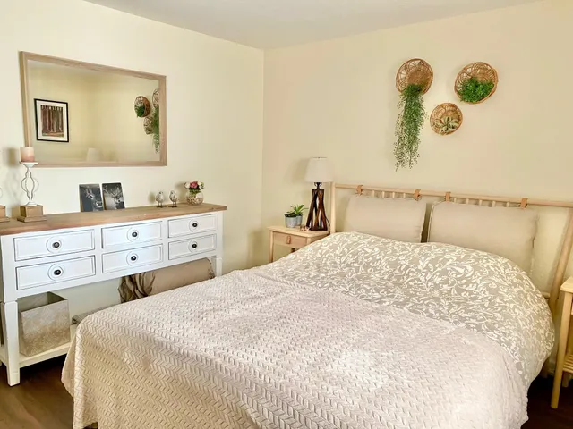 a bedroom with a bed and a closet