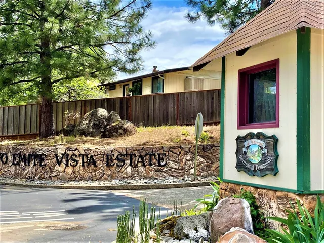 a view of a backyard of the house